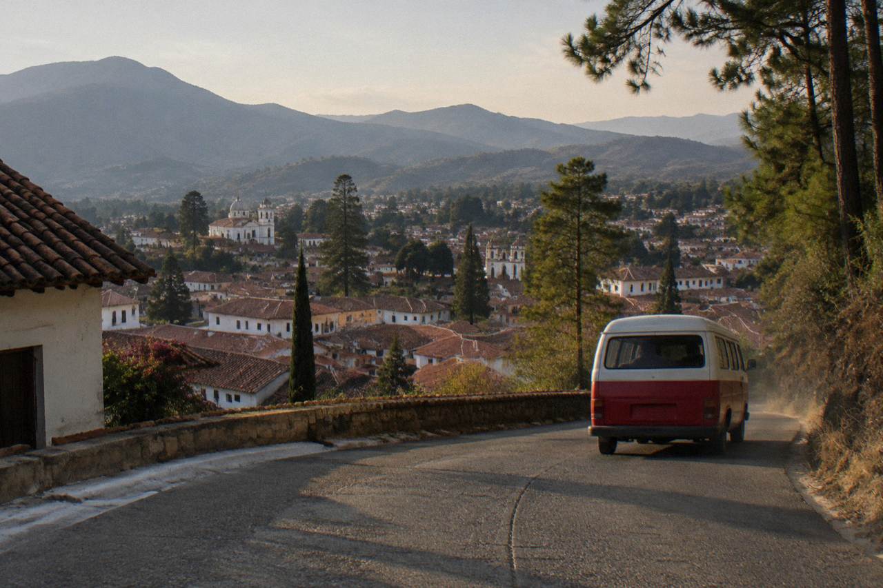 Mountain highway winding through green hills toward San Cristobal de las Casas