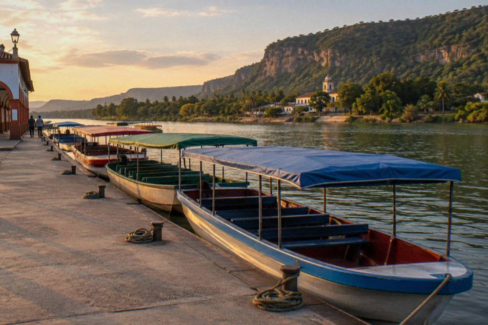 A row of covered tour boats moored at a riverside dock in late afternoon light