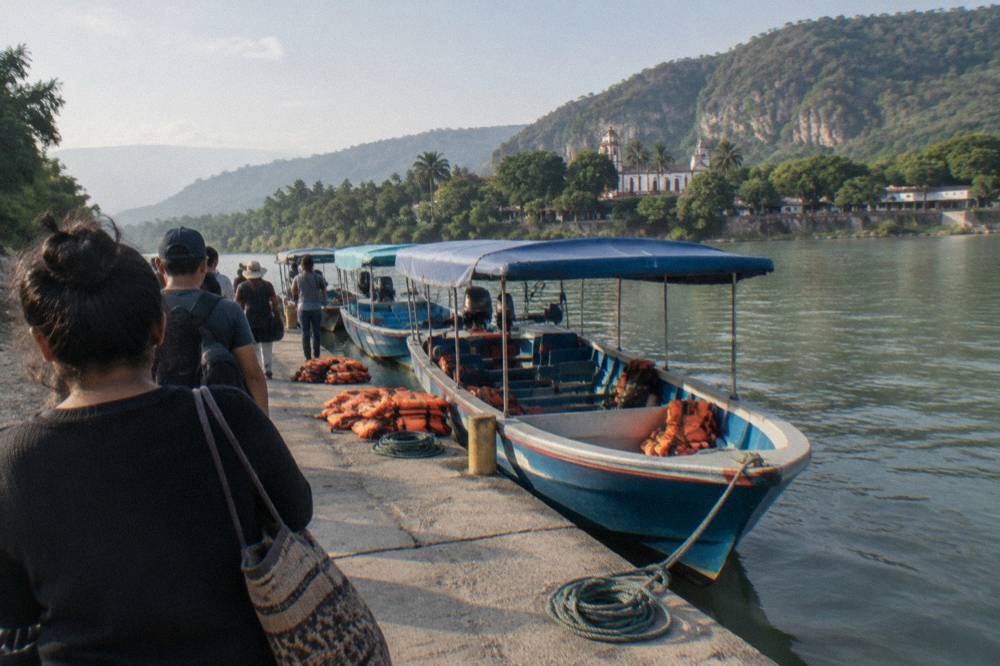 Long shared boats moored at the Chiapa de Corzo embarcadero on the Grijalva River