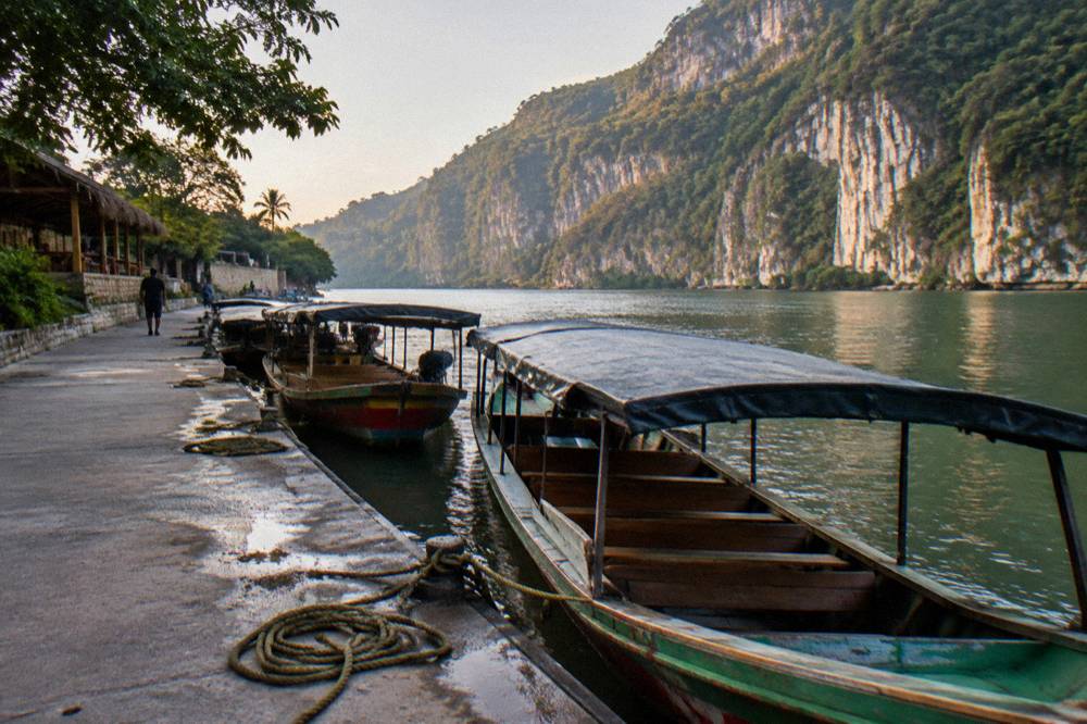 Boats moored at a riverside dock on the Grijalva River