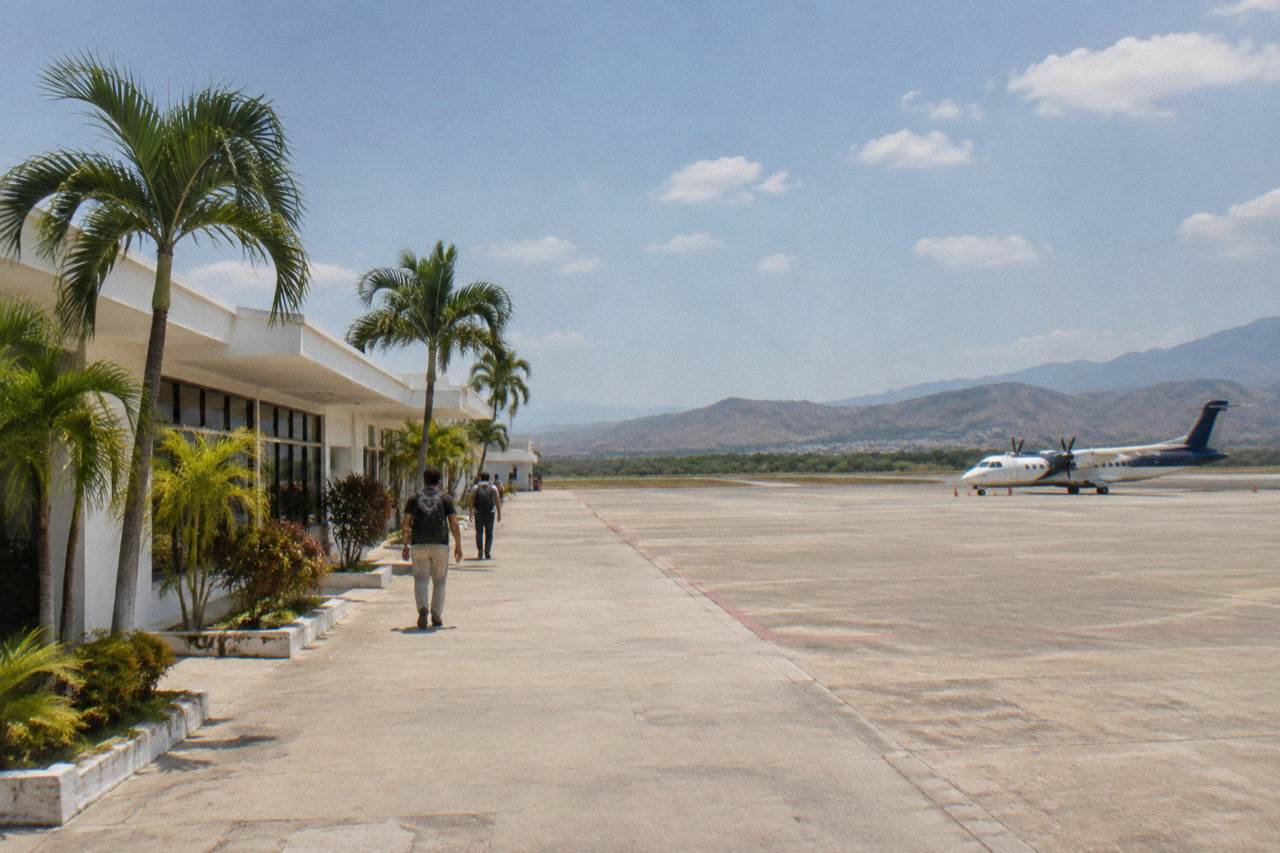 Small regional airport terminal building under a wide tropical sky in Chiapas